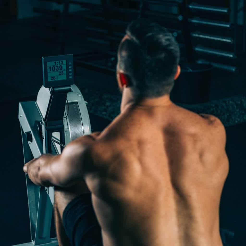 Muscular Man on Rowing Machine