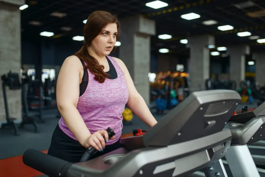 Overweight Woman Running on Treadmill