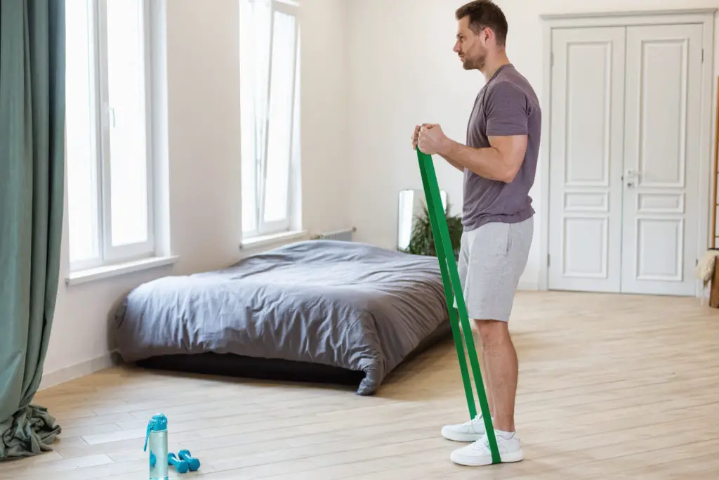 Man Exercising Using Resistance Bands Loop