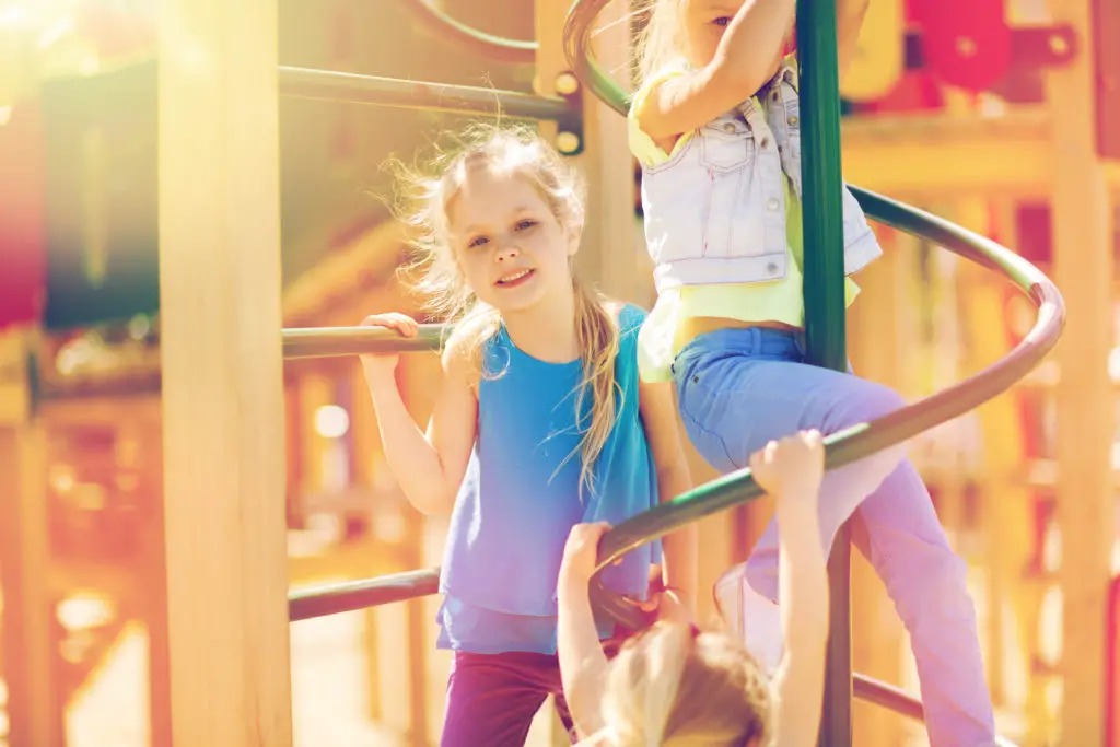 Kids on Playground Climbing Frame