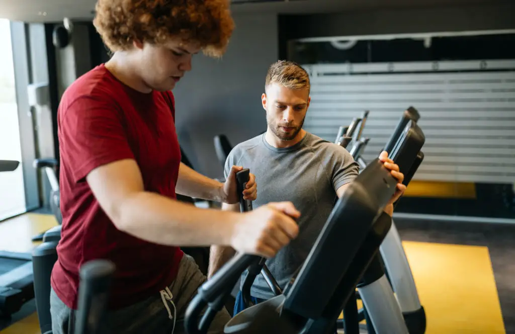 Overweight Man on the Elliptical