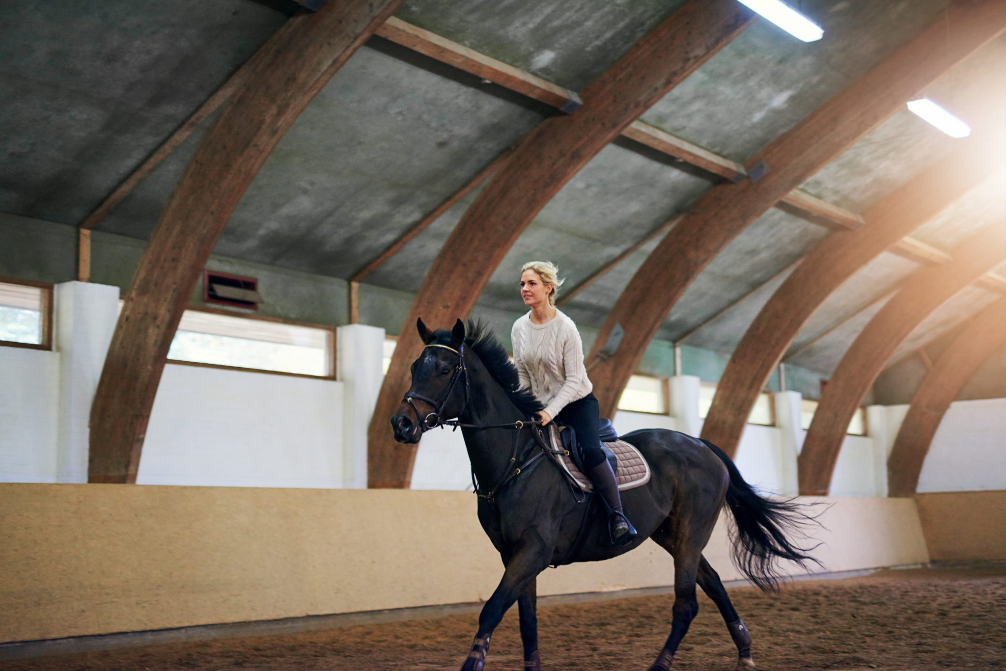 Woman Using Horseback Riding Exercise Machine 4 Great Fitness Trackers for Horseback Riding (That You'll Love)