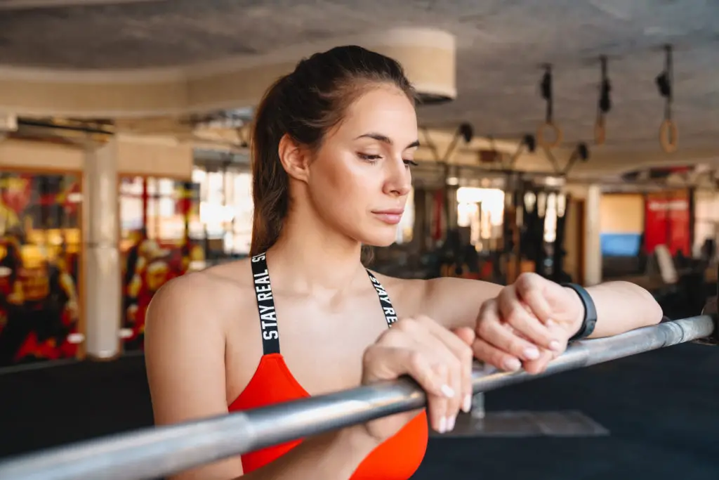 Woman Wearing Fitness Tracker in Gym