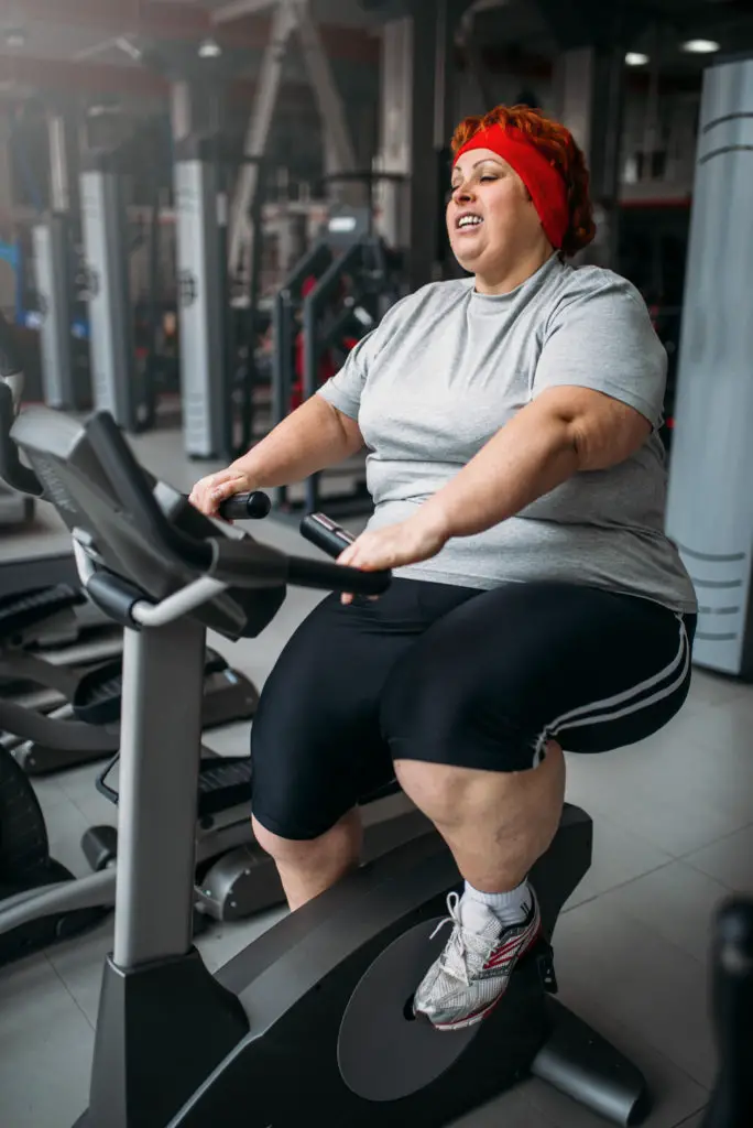 Overweight Woman on Exercise Bike