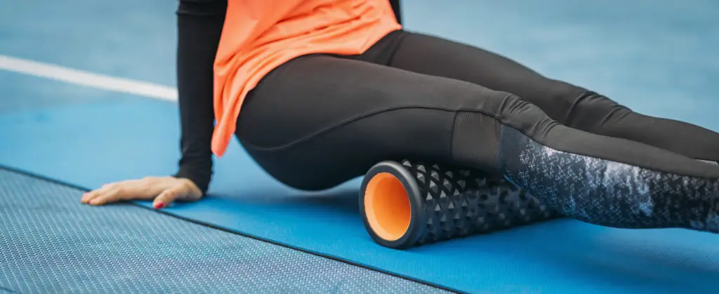 Young Woman Foam Rolling