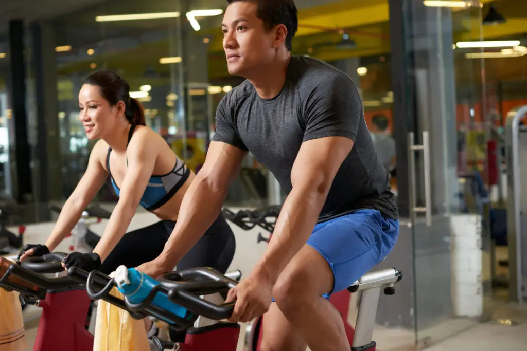 Man and Woman on Stationary Bike