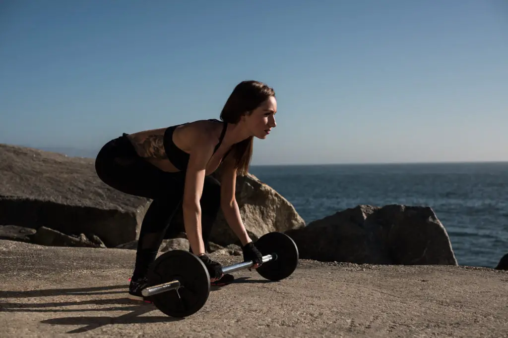 Fit woman lifting weights