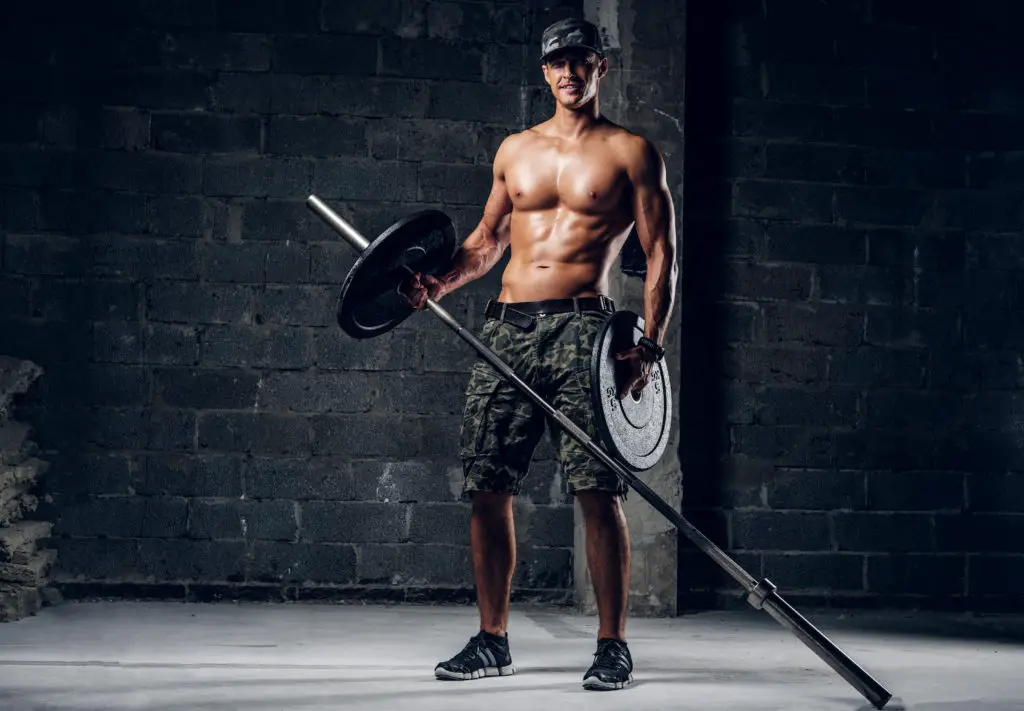 Man Lifting Weight In Garage